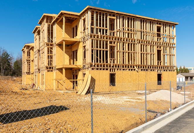 a snapshot of temporary chain link fences protecting a large construction project from unauthorized access in Lexington